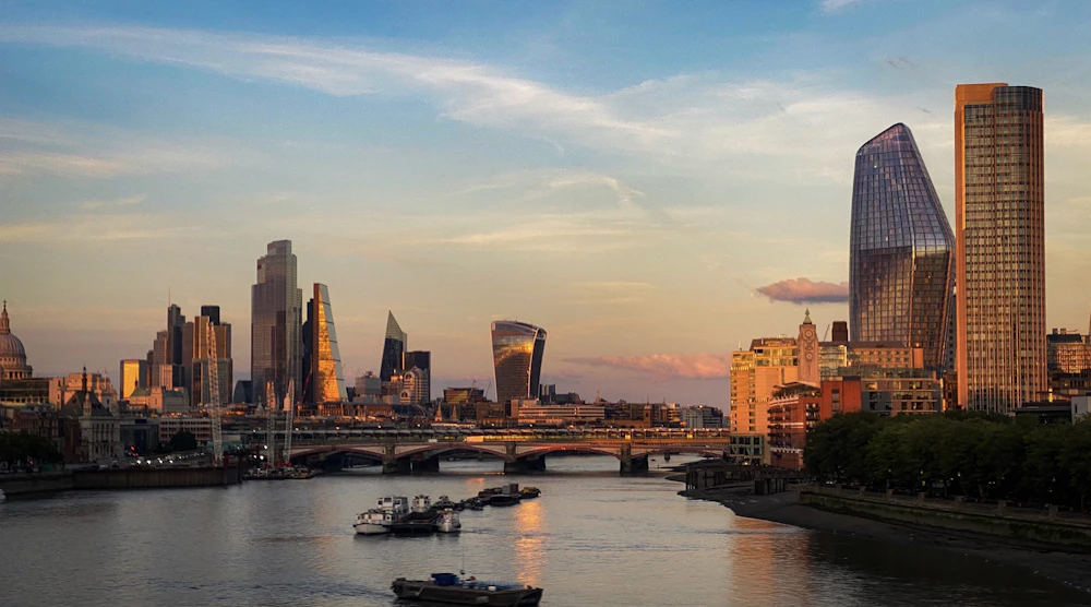 London skyline beside the River Thames at sunset